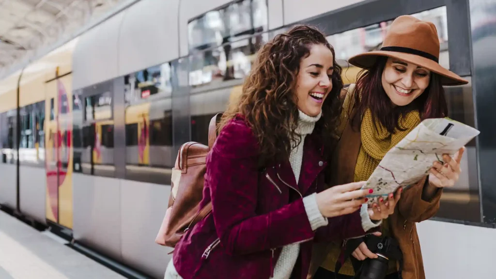Two women at train station